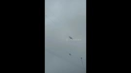 Two electric workers move as fast as spiders on high-voltage power