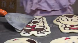 Pancakes with cartoon faces made at street food stall in Thailand
