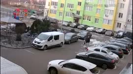 CCTV camera captures moment man runs for cover as Russian rockets hit residential area of Nikolaev, Ukraine 1/2