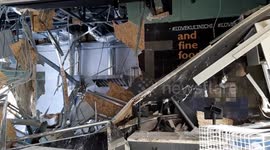Russian shelling destroys Kharkiv mall, while police document unexploded bombs