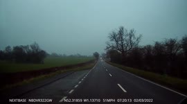 Stobart HGV in a field just of the A5 near to the town of Weedon UK