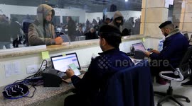 Palestinian workers wait at the Erez crossing as they prepare to leave Beit Hanun in the northern Gaza Strip, to go to work inside Israel