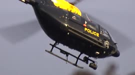 Police helicopter circles above Royal Albert Hall during the 75th British Academy Film Awards - London