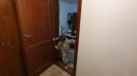 5-year-old Jacob making door frame climbing trick with assist of his grandmother