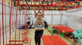 5-year-old Jacob excercises on hanbar during ninja warrior kids traing