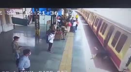 Man falls down moving train during boarding mishap, gets rescued by alert cop in western India