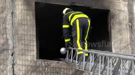 At least two dead after Russian shell hits residential building in Kyiv