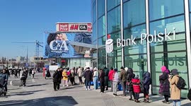 Refugees line up at Polish banks to access cash after fleeing Ukraine