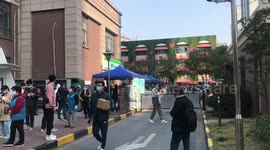 Shanghai residents queue for COVID-19 tests during their 14-day quarantine period