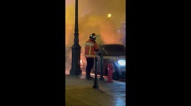 Firefighter puts out car set alight during riots over jailed nationalist in Corsica
