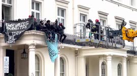 A Group Of Protesters Shout Slogan Anti Russia At Oleg Deripaska 50 Million Occupied Property While Someone Attempt Climb The Wall  And To Break Into The Adjacent Romanian Embassy