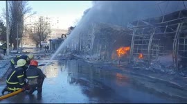 Firefighters battle to extinguish flames after shelling strikes marketplace in Kharkiv