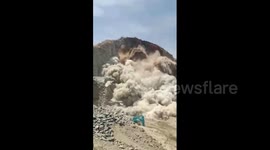 Huge chunks of stone collapse on mining operation in India, trapping workers