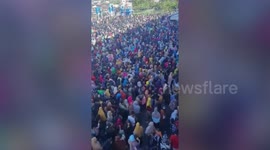 Hundreds of people queue to buy cheap cooking oil in Indonesia