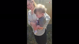 'Hungry baby boy tries to eat a lizard crawling on his dad's shirt! 
'