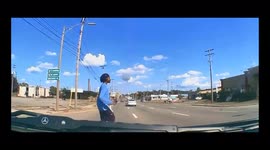 CLOSE CALL: Pedestrian wearing hearphones almost ran over as they didn't hear oncoming traffic (Dashcam Video)