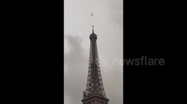 New antena installed by helicopter on the top of the Eiffel Tower in Paris, France