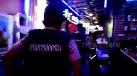 Shocked tourists watch as police raid bar 'selling child prostitutes to tourists' in Bangkok