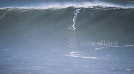 Big wave surf wipeout and jetski rescue in Nazare Portugal