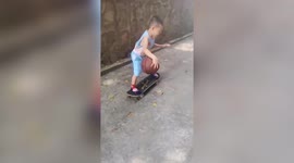 Talented boy dribbles basketball through legs while moving on skateboard