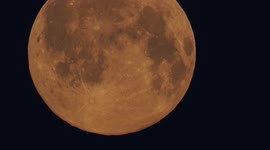 Stunning close-up of full 'Worm Moon' setting in Kent, UK