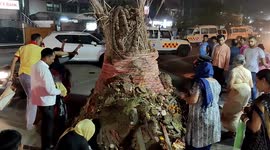 Indian Families gather at bonfires to pray and perform rituals for Holika Dahan