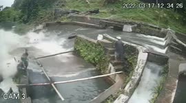 Woman swept away into lake after pond wall collapses in Indonesia