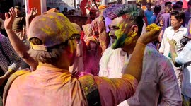 Indian people's celebrating Holi by colour and dancing