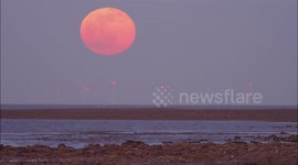 Stunning 'Worm Moon' seen rising above beach in Kent, UK