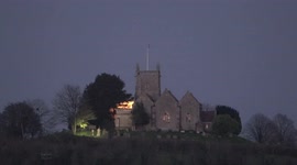 Spectacular full moon rises above St Arilda's Church in Gloucestershire