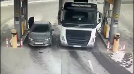 Terrifying moment truck crushes Russian petrol station customer