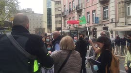 Amnesty International activists stage protest in front of Russian embassy In Lisbon, Portugal