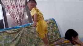 2 year old agent funny action playing horse with mother in room Jakarta Indonesia