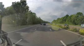dash cam of cars racing and undertaking on the motorway