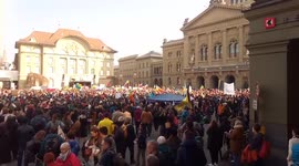 Ukrainian president addresses crowd on giant screen at anti-war protest in Switzerland