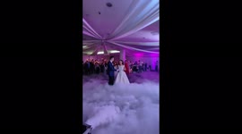 The cameraman at the wedding falls and continues to take photos