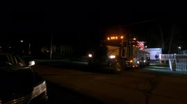 Heavy rotating tow truck rescues a Ford F - 150 from the creek in Coal Township, Pennsylvania