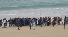 A Christian Baptism in the Ocean. Hundreds of Christians travelled from Exeter in  Devon to Fistral beach to witness a baptism in the ocean waves