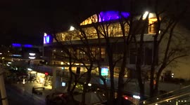The Southbank Centre on the River Thames glowing blue and yellow - London