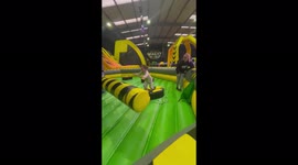 'Little girl BENT IN HALF after getting struck by spinning bar on bouncy house '