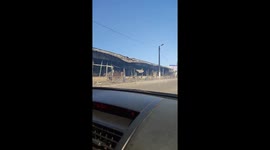 Motorist drives past charred remains of huge market in Kharkiv destroyed by Russian shelling
