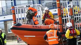 With good weather in the English Channel an RNLI lifeboat rescues three migrants