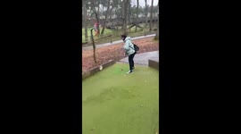 Woman gets unconventional hole in one after mishitting mini-golf shot