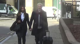 Tennis star Boris Becker and his partner arrive at London court for bankruptcy trial