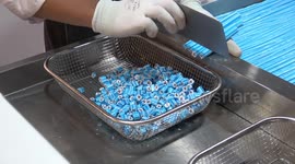 Satisfying ASMR video shows candy sticks being crushed