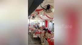 Drive-thru wedding! Motorcycles pass through couple's ceremony in Cambodia