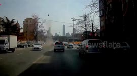 Manhole cover narrowly misses car after flying into sky due to methane explosion in China