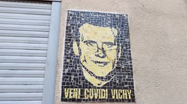 Sarcastic street art mosaic on french President  Emmanuel Macron. Paris, Butte-aux-Cailles, Paris 13th arrondissement. 23 march 2022