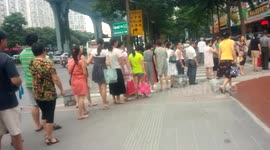 Anxious parents long queue to pick up kids