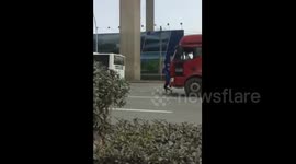 Bizarre video sees woman run in front of truck in staged crash